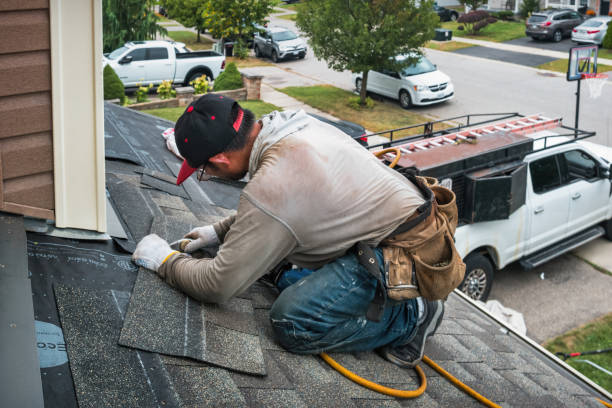 Professional Roofing technician working in Mason City, IA